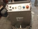 a machine that is sitting on the floor in the garage