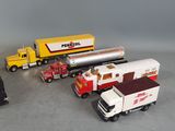 a lot of toy trucks that are sitting on the floor