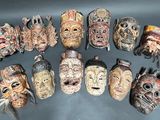 a lot of masks that are sitting on a table