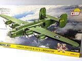a box with a model of a green airplane in it