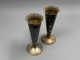 two vases that are sitting on a table