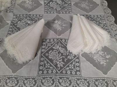 two white napkins sitting on top of a table