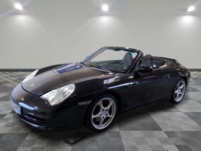an image of a black sports car parked in a garage