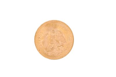 a close up of a gold coin on a white background