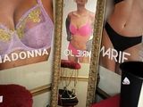 a picture of a woman in a bra and a mirror