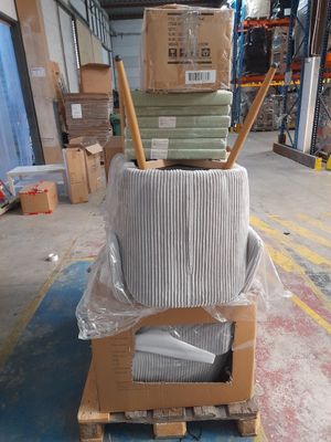 a stack of boxes on top of a pallet in a warehouse