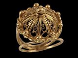 a close up of a gold ring on a black background