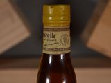 a bottle of wine that is sitting on a table