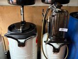 two buckets and a tank on a shelf next to a blue bucket