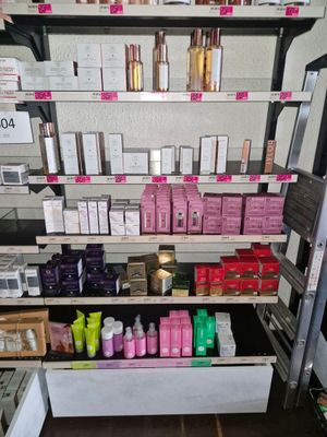many different types of cosmetics on the shelves in the store