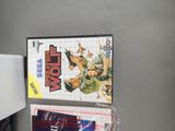 two video games on the wall next to each other