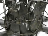 a metal sculpture of a bunch of blades on a white surface