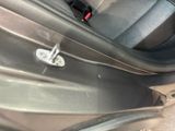a close up of a car door handle with a latch