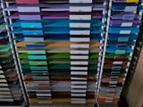 a lot of folders that are stacked on a rack
