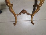 a small table with a marble top on it