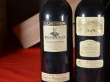 three bottles of wine that are sitting on a table
