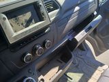a picture of a car dashboard with a digital device in it
