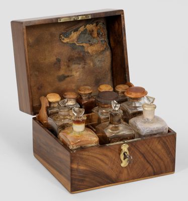 an image of a wooden box filled with bottles of different types