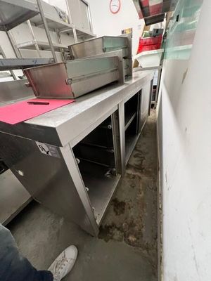 a man that is standing in front of a conveyor belt