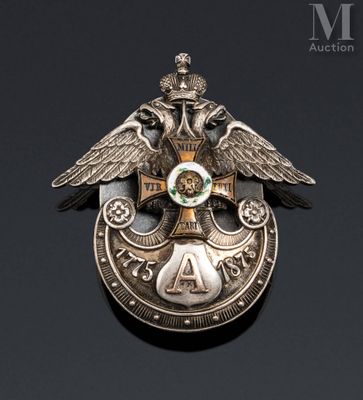 a close up of a badge on a black surface
