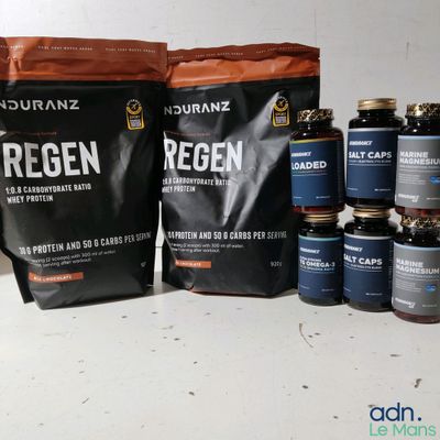 many bags of protein sitting next to each other on a table
