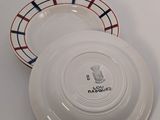 a white plate with a red, blue, and white design on it
