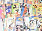 a lot of mickey mouse books on the table