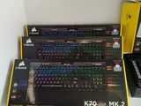 a lot of computer keyboards sitting on a table