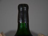 a bottle of wine that is sitting on a table