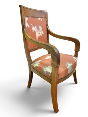 an image of a wooden chair with a floral upholstered seat