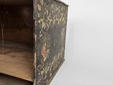 a small wooden box with a floral design on it