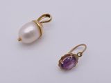 a pair of amethorate and pearl earrings