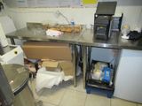 an image of a kitchen with a lot of clutter on the counter