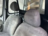two seats in the back of a van with no one in it