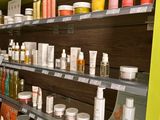 many different types of skin care products on the shelves
