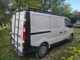 a white van that is parked in the grass