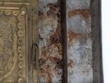 an old metal box with a painting on it