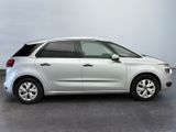 a picture of a white citrole parked in a parking lot