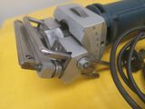 an image of a drill with a cord attached to it