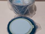 a plastic bowl and a plastic plate on a table
