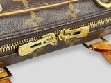 a close up of a louis vuitton bag with a strap