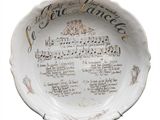 a white plate with music notes and words on it