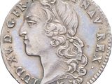 a close up of a coin with a woman ' s face on it