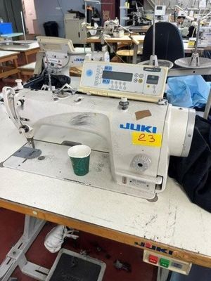 an image of a sewing machine in a factory