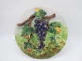 a picture of a decorative plate with grapes on it
