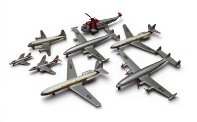 beaucoup d'avions regroupés sur une surface blanche
