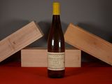 a bottle of wine that is sitting on a table