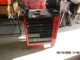 an image of a red and black tool cart in a garage