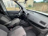 the interior of a small car with the front seats folded down