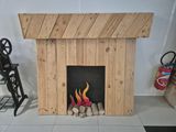 a fire place made out of pallets and logs